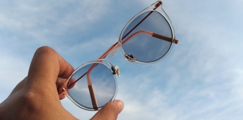 eyeglasses in hand